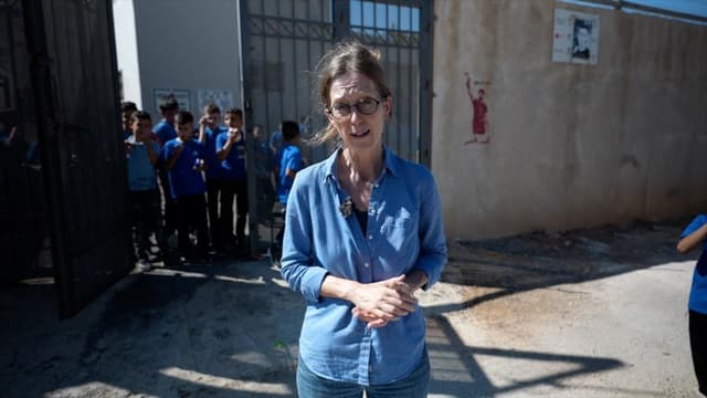 Pupils return to West Bank school behind barbed wire to protect against settlers