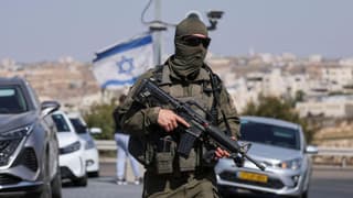 Five Israelis wounded and two suspected Palestinian attackers killed in West Bank shooting