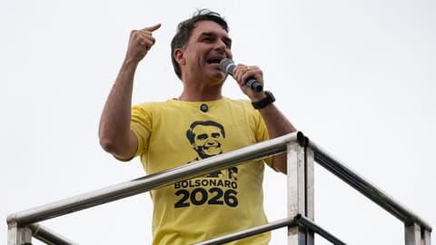 Flávio Bolsonaro rides right-wing wave to win first round of Brazil election