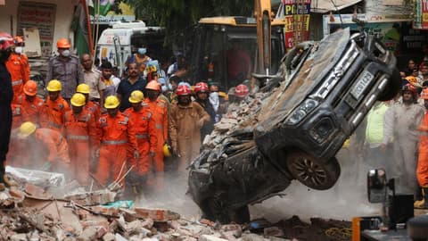 Dozens feared trapped in collapsed building in Delhi