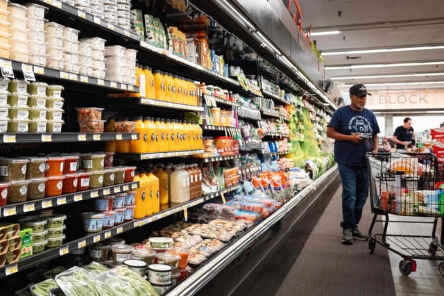 US inflation rises less than expected, tempering Fed hike concerns
