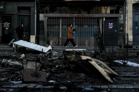 Police arrest 1,800 after worst rioting in years shakes France