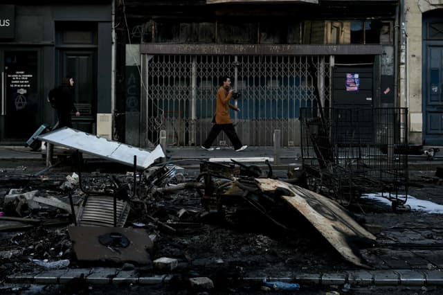 Police arrest 1,800 after worst rioting in years shakes France