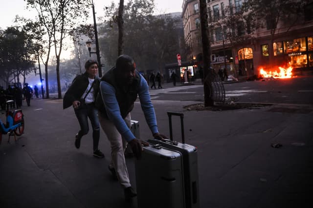 Tourists trade cafes for barricades in France gripped by unrest