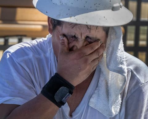 ‘Your body fights to stay cool’: workers toil in record heat as federal rule frozen