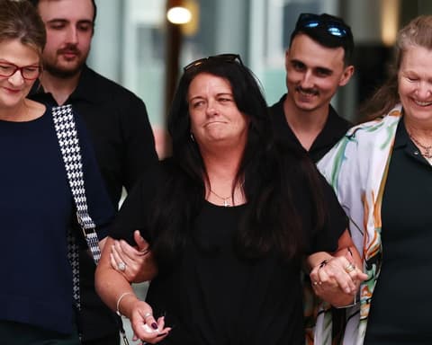 Cheers as murder charge dismissed for Queensland woman who helped terminally ill husband die
