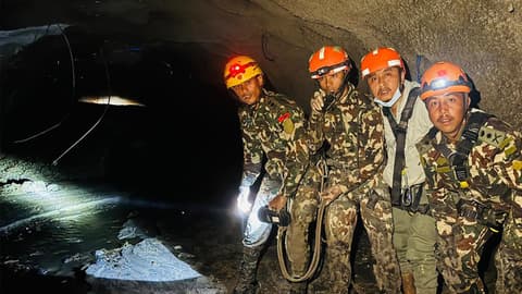 Nepal's rescuers navigate mud-swamped tunnels for hundreds of missing workers