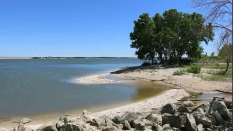 Kansas couple transforms backyard into a 100,000-gallon tropical lagoon with six waterfalls