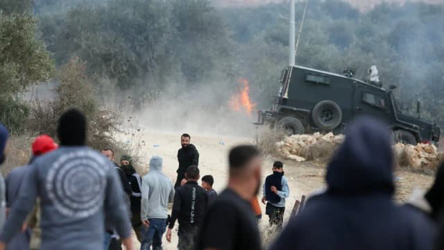 Israeli settlers attack Palestinian villages, torch cars and trees during olive harvest